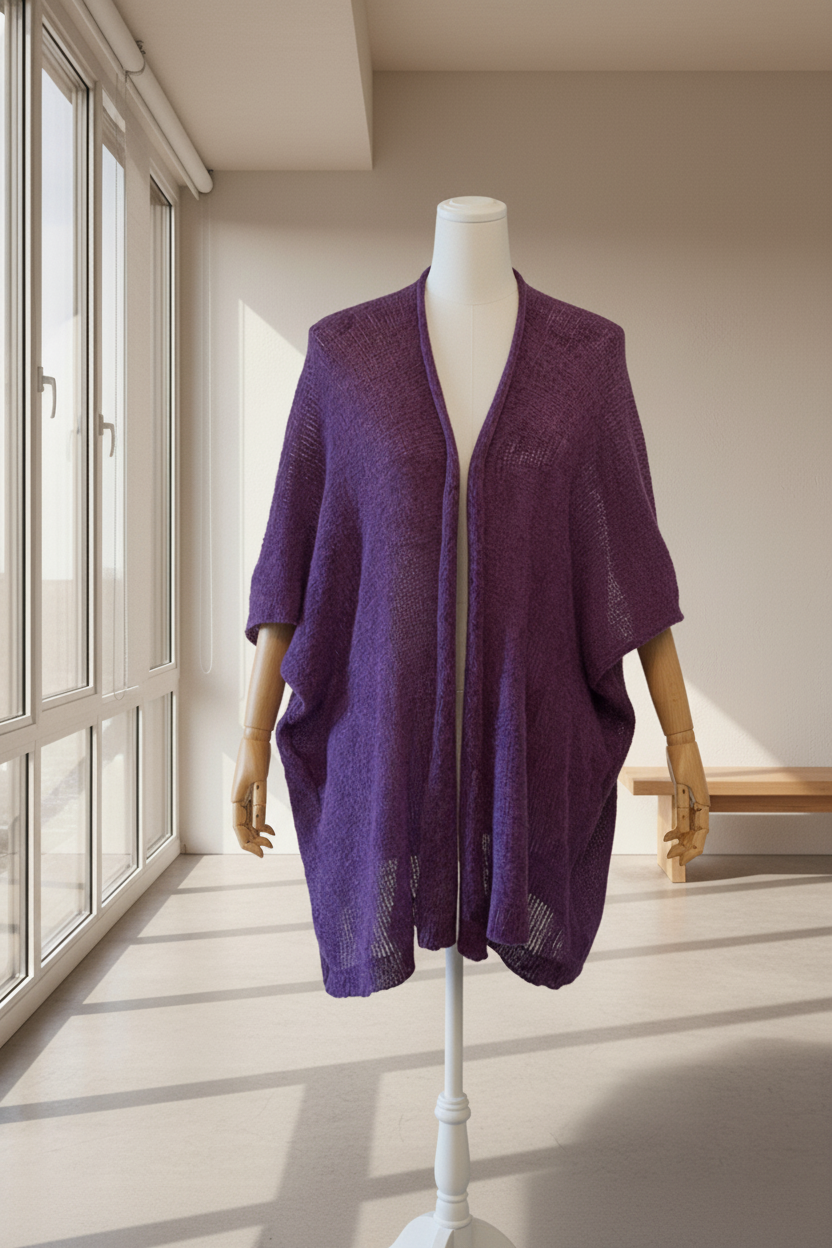 Purple Haze alpaca mohair cape displayed on a modern bust with wooden arms